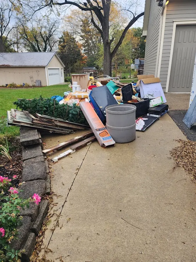 Dumpster being loaded with debris for Residential Dumpster Rental in Thornton